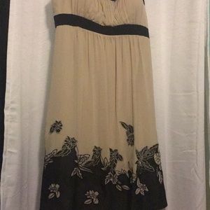 Cream colored dress with black floral detailing